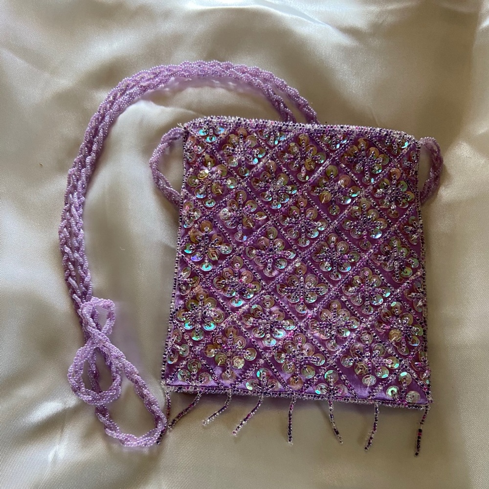 A very delicate beaded mini bag with beaded strap